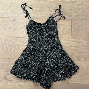 This is a Princess Polly romper. This is a black and white flower romper.